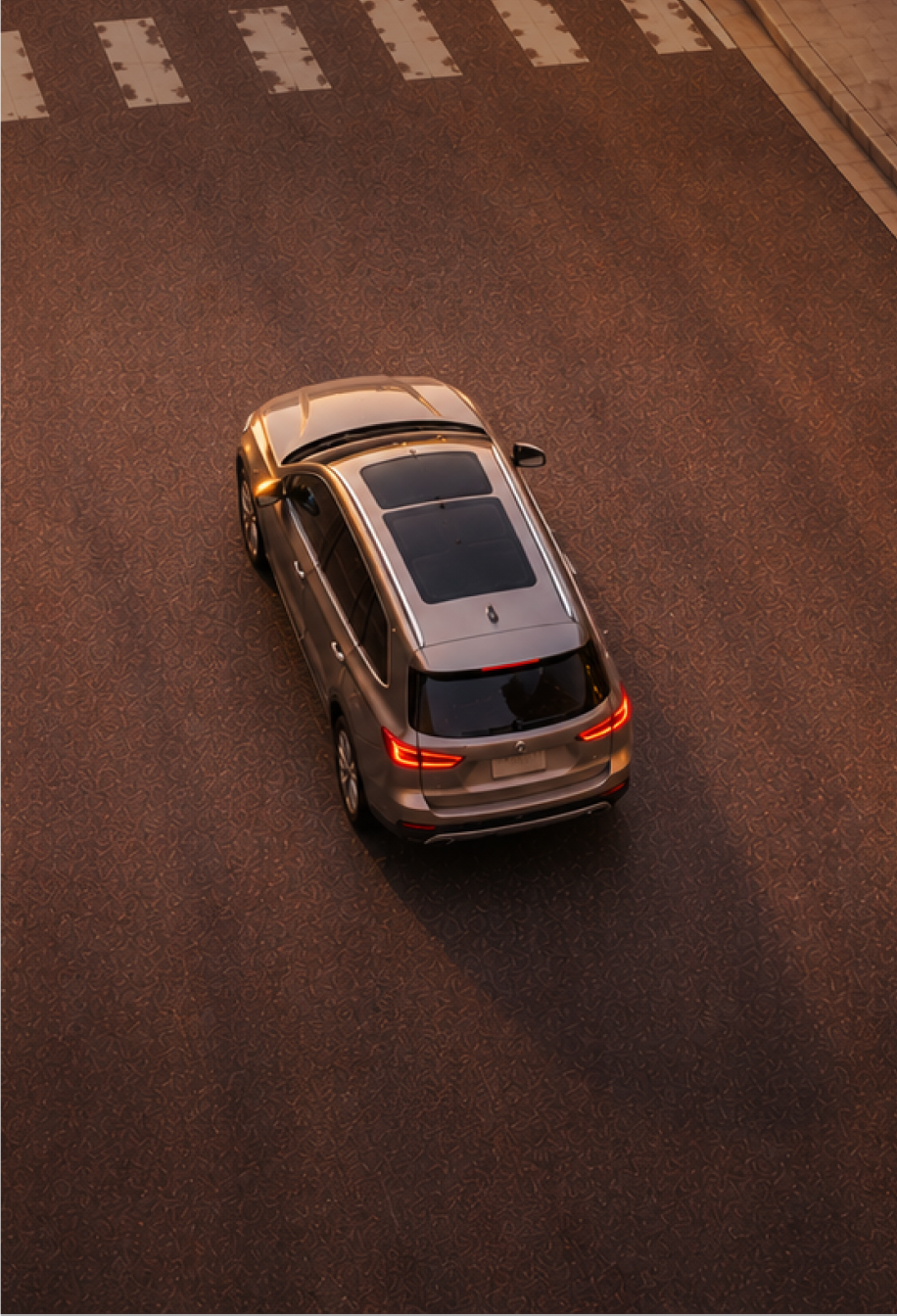 Car driving on a road from above